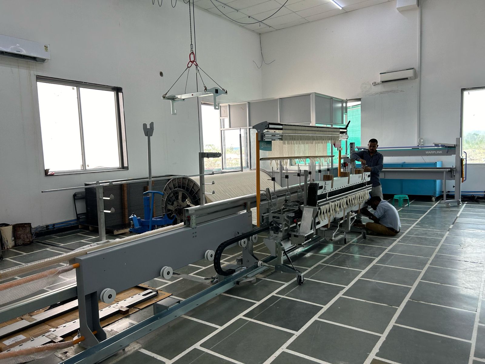 Modern loom shed with weaving machines