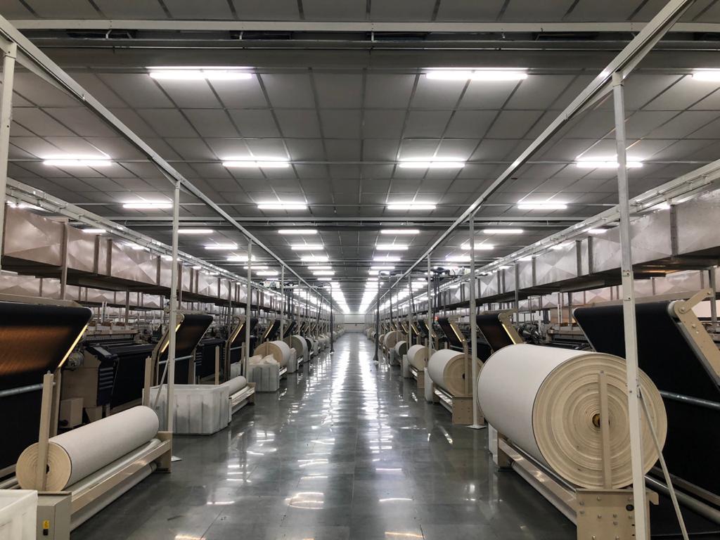 Modern loom shed with weaving machines